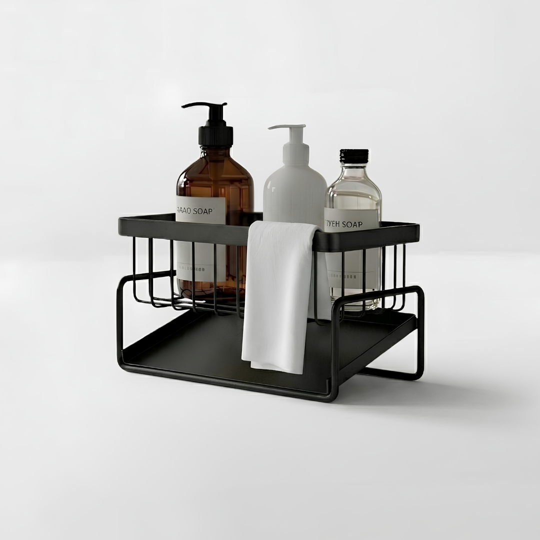 Nomi Countertop Caddy holding sponge, soap, and dish brush at the kitchen sink